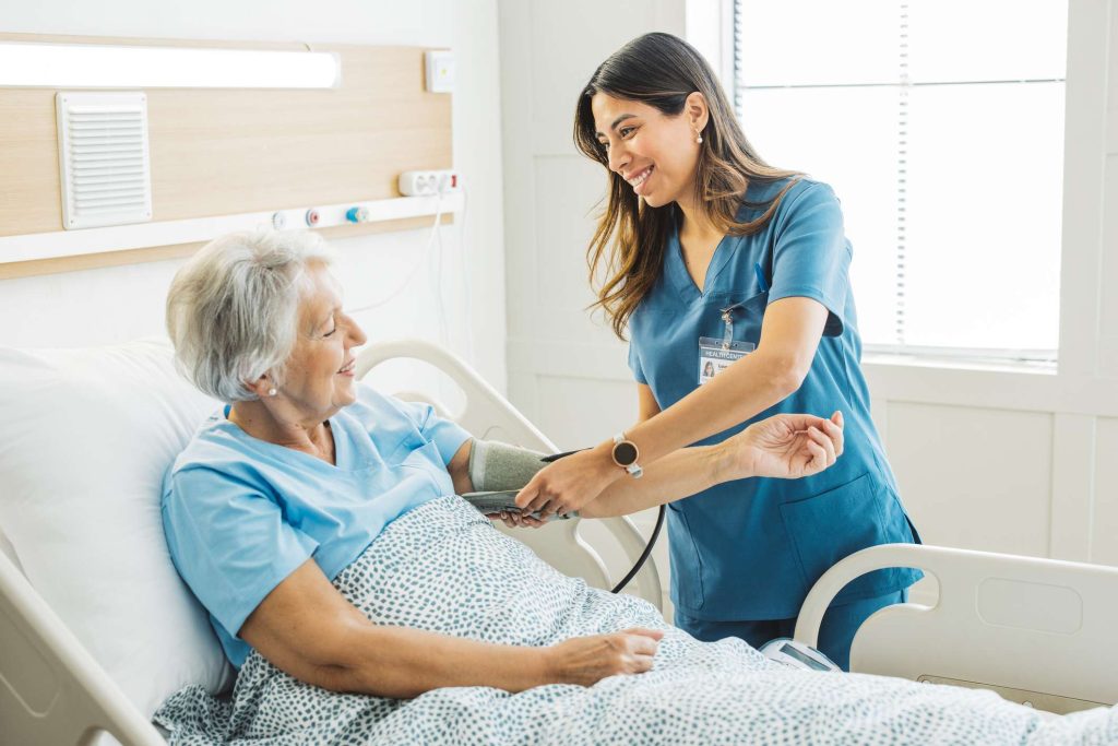Nurse taking patient blood pressure