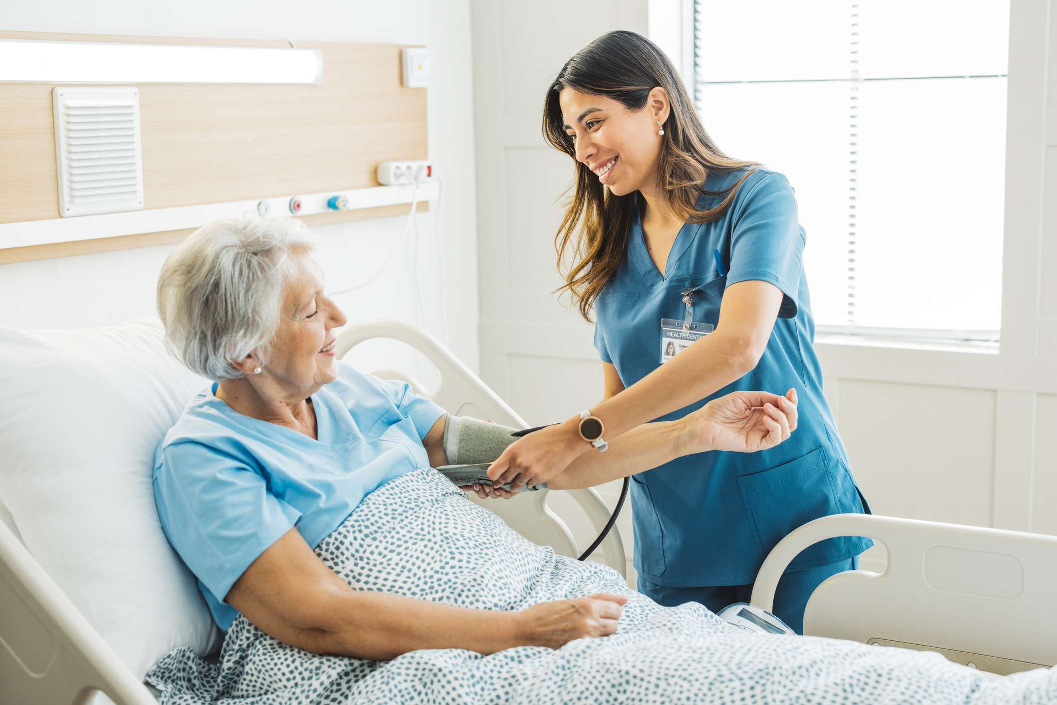 Nurse taking patient blood pressure