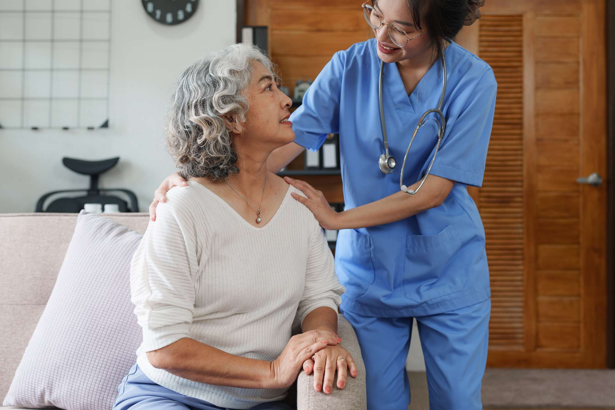 Nurse assisting patient image