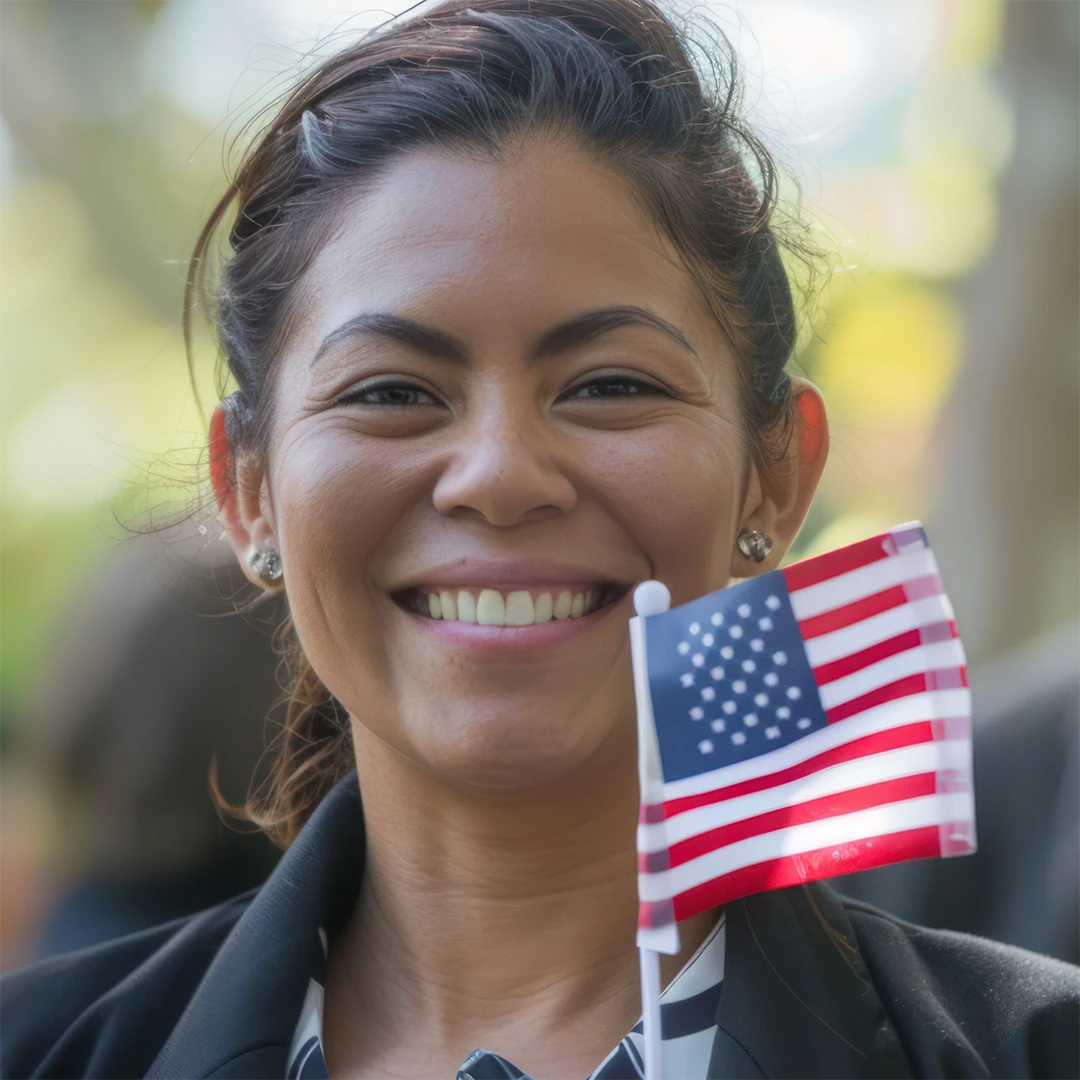 medical professional smiling holding American flag