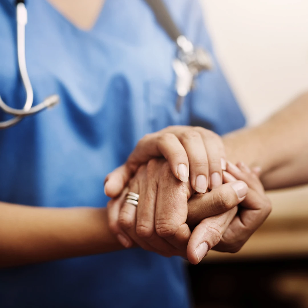 close up of nurse holding patient hand image