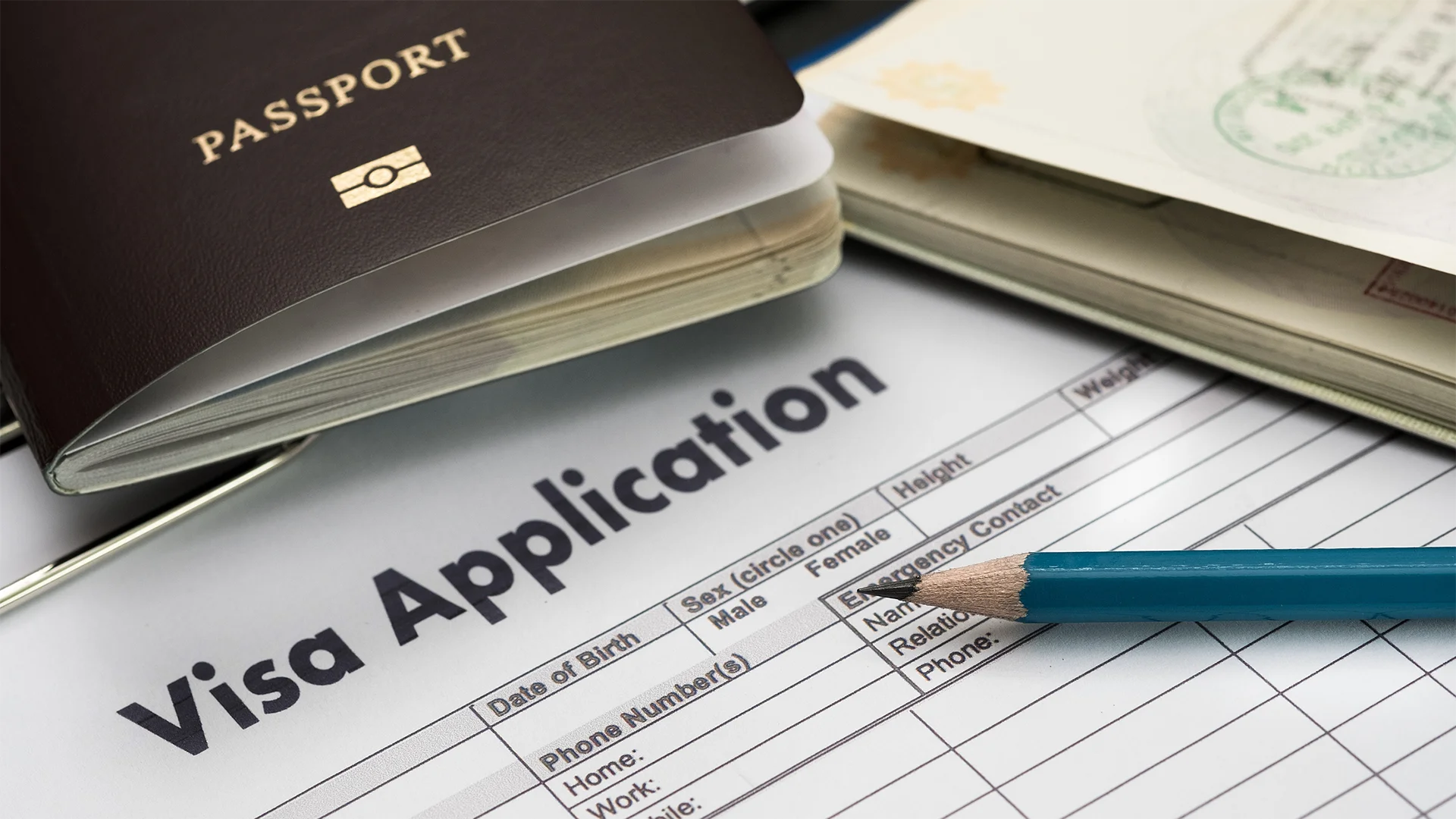 passport and visa application on table