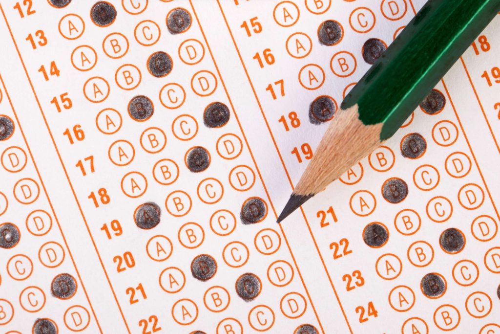 Filled out scantron sheet and pencil image