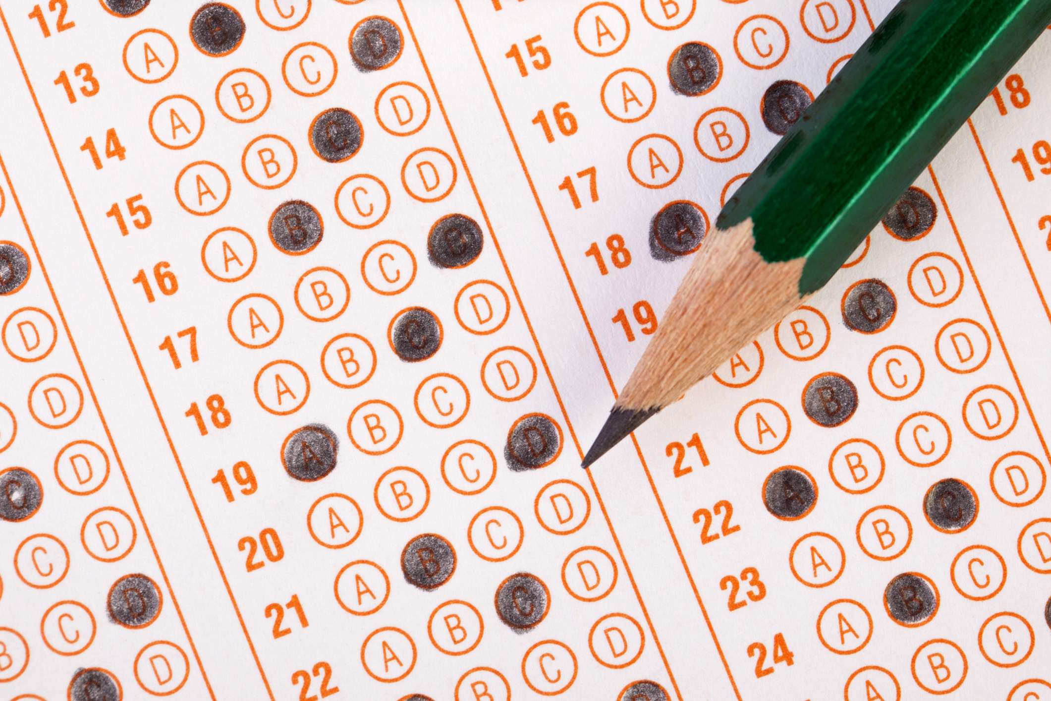 Filled out scantron sheet and pencil image