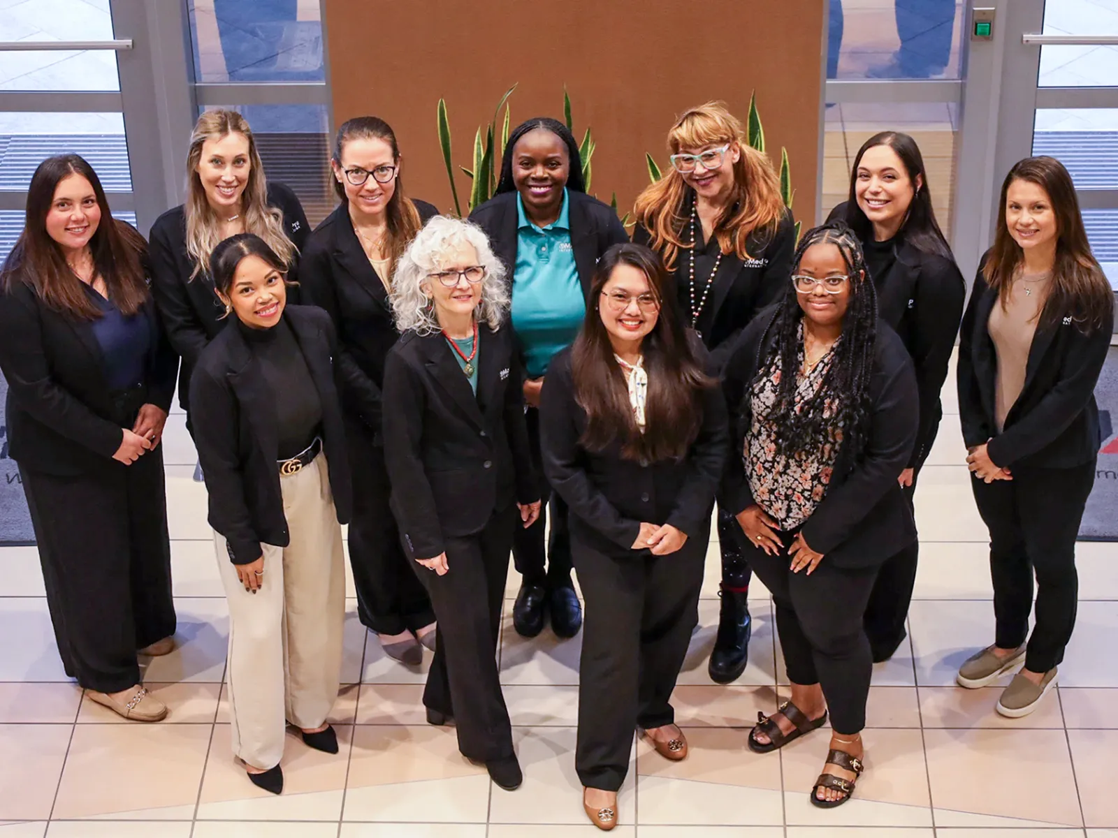 Picture of dedicated group of educators smiling in office building