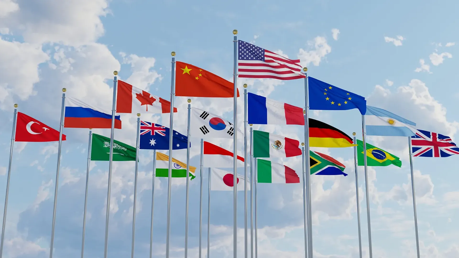 Picture of multiple countries flags waving on flag poles